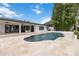 A backyard pool and patio area featuring tropical landscaping, fountains, and luxurious features at 7145 Lake Dr, Orlando, FL 32809