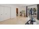 Bright room with marble tile floor, exercise bike, glass table and view to the patio at 7145 Lake Dr, Orlando, FL 32809