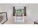 Sun-filled room with marble floors, large window view, modern lighting, and neutral colors at 7145 Lake Dr, Orlando, FL 32809