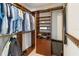 Organized walk-in closet with custom shelving and storage solutions for clothing and accessories at 7145 Lake Dr, Orlando, FL 32809