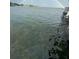 Waterfront view of the lake with a rainbow overhead at 7145 Lake Dr, Orlando, FL 32809