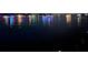 Scenic waterfront view at night with colorful lights reflecting on the lake at 7145 Lake Dr, Orlando, FL 32809