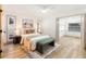 Bright main bedroom features wood floors, neutral colors, and a walk-in closet at 7446 Houston E Ct, Winter Park, FL 32792