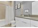 Clean bathroom with a neutral color scheme and modern fixtures at 7740 Sandy Ridge Dr # 124, Reunion, FL 34747