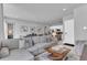 Open-concept living space with modern furnishings and seamless flow into the dining area at 7740 Sandy Ridge Dr # 124, Reunion, FL 34747