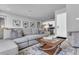 Spacious open living area with comfortable seating, access to the dining room and kitchen at 7740 Sandy Ridge Dr # 124, Reunion, FL 34747