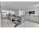 Large open living space with dining area, modern kitchen and comfortable seating area at 7740 Sandy Ridge Dr # 124, Reunion, FL 34747