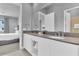 Main bathroom with double vanity, modern fixtures, and convenient access to the connected bedroom at 7740 Sandy Ridge Dr # 124, Reunion, FL 34747