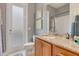 Bathroom featuring granite countertops, modern fixtures, and a walk-in shower at 7918 Esta Ln, Orlando, FL 32827