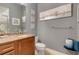 Cozy bathroom with granite countertop vanity and framed mirror at 7918 Esta Ln, Orlando, FL 32827