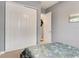 Comfortable bedroom featuring closet, neutral colors, and natural light at 7918 Esta Ln, Orlando, FL 32827