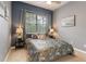 Comfortable bedroom with natural light, neutral colors, and stylish decor at 7918 Esta Ln, Orlando, FL 32827