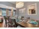 Formal dining room with a large wooden table, chandelier, and elegant place settings at 7918 Esta Ln, Orlando, FL 32827