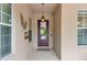 Inviting front entrance featuring a decorative glass door and stylish sidelight windows at 7918 Esta Ln, Orlando, FL 32827