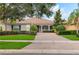 Charming single-story home with a brick driveway and beautifully landscaped front yard at 7918 Esta Ln, Orlando, FL 32827