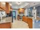 Well-equipped kitchen with stainless steel appliances, granite countertops, and ample cabinetry at 7918 Esta Ln, Orlando, FL 32827