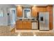 This kitchen features granite countertops, stainless steel appliances, and wood cabinets at 7918 Esta Ln, Orlando, FL 32827