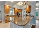 Well-equipped kitchen featuring granite countertops, stainless steel appliances, and ample cabinet space at 7918 Esta Ln, Orlando, FL 32827
