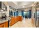 Bright and airy kitchen with granite countertops, stainless appliances, and open to dining area at 7918 Esta Ln, Orlando, FL 32827