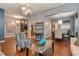 Open-concept living area showcasing hardwood floors, stylish decor, and ample natural light at 7918 Esta Ln, Orlando, FL 32827