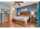 Main bedroom with hardwood floors, wood furniture, and ample closet space at 7918 Esta Ln, Orlando, FL 32827