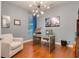Spacious office with hardwood floors, a modern light fixture, and a large window at 7918 Esta Ln, Orlando, FL 32827