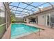 Relaxing screened-in pool area with ample seating at 7918 Esta Ln, Orlando, FL 32827
