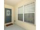 Welcoming front door with decorative glass insert and sidelight window, showcasing a charming entrance at 8093 Indian Creek Blvd, Kissimmee, FL 34747