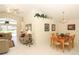 Open-concept space with a dining area, sofa and a view of the pool area at 8093 Indian Creek Blvd, Kissimmee, FL 34747