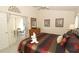 Relaxing main bedroom with sliding doors to the patio and a dresser with a mirror at 8093 Indian Creek Blvd, Kissimmee, FL 34747