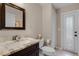 Bathroom featuring marble countertops, a toilet, and access to the outdoors at 831 Royalwood Ln, Oviedo, FL 32765