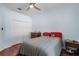 Bedroom featuring a ceiling fan, closet, wood floors and light blue walls at 831 Royalwood Ln, Oviedo, FL 32765