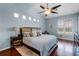 Calm bedroom featuring a ceiling fan, lots of light, and an area rug at 831 Royalwood Ln, Oviedo, FL 32765
