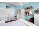Bedroom featuring light blue walls, wood floors and a white closet at 831 Royalwood Ln, Oviedo, FL 32765