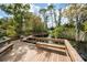 Charming wooden boardwalk with benches, winding through a lush landscape by the water at 831 Royalwood Ln, Oviedo, FL 32765