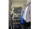 Organized walk-in closet featuring shelving for shoes and plenty of hanging storage at 831 Royalwood Ln, Oviedo, FL 32765