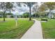 Community park with playground, walking path, picnic benches, and green space at 831 Royalwood Ln, Oviedo, FL 32765