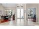 Light-filled foyer featuring a decorative tile floor and views of the dining room and office at 831 Royalwood Ln, Oviedo, FL 32765