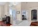 Open foyer with ceramic tile flooring, glass front door, and views into other rooms at 831 Royalwood Ln, Oviedo, FL 32765