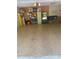 Spacious garage with epoxy floors features storage shelving and a secondary refrigerator at 831 Royalwood Ln, Oviedo, FL 32765