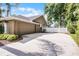 A large driveway and spacious three-car garage at 831 Royalwood Ln, Oviedo, FL 32765