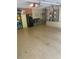 Well-lit garage with epoxy floors offering ample storage, refrigeration and utility solutions at 831 Royalwood Ln, Oviedo, FL 32765