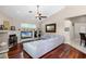 Spacious living room featuring a fireplace and tile flooring, open to the kitchen and dining area at 831 Royalwood Ln, Oviedo, FL 32765
