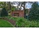 A welcoming brick sign with the name 'Royalwood Estates' surrounded by lush greenery at 831 Royalwood Ln, Oviedo, FL 32765