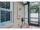 Enclosed outdoor shower with a brick-paved floor and seamless access to the screened lanai at 831 Royalwood Ln, Oviedo, FL 32765