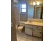 This bathroom features a window, sink, and bath with shower at 1050 Reading Ct, Winter Park, FL 32792