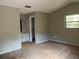 Cozy bedroom with carpet flooring, and view of the ensuite at 1050 Reading Ct, Winter Park, FL 32792