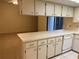 Kitchen with counter overlooking living room and dishwasher at 1050 Reading Ct, Winter Park, FL 32792