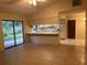Open-concept living room featuring tile flooring and sliding glass doors to the outdoor patio at 1050 Reading Ct, Winter Park, FL 32792