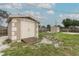 Backyard shed featuring double doors and a convenient ramp for easy access and storage at 1078 Aaron Dr, Deltona, FL 32725